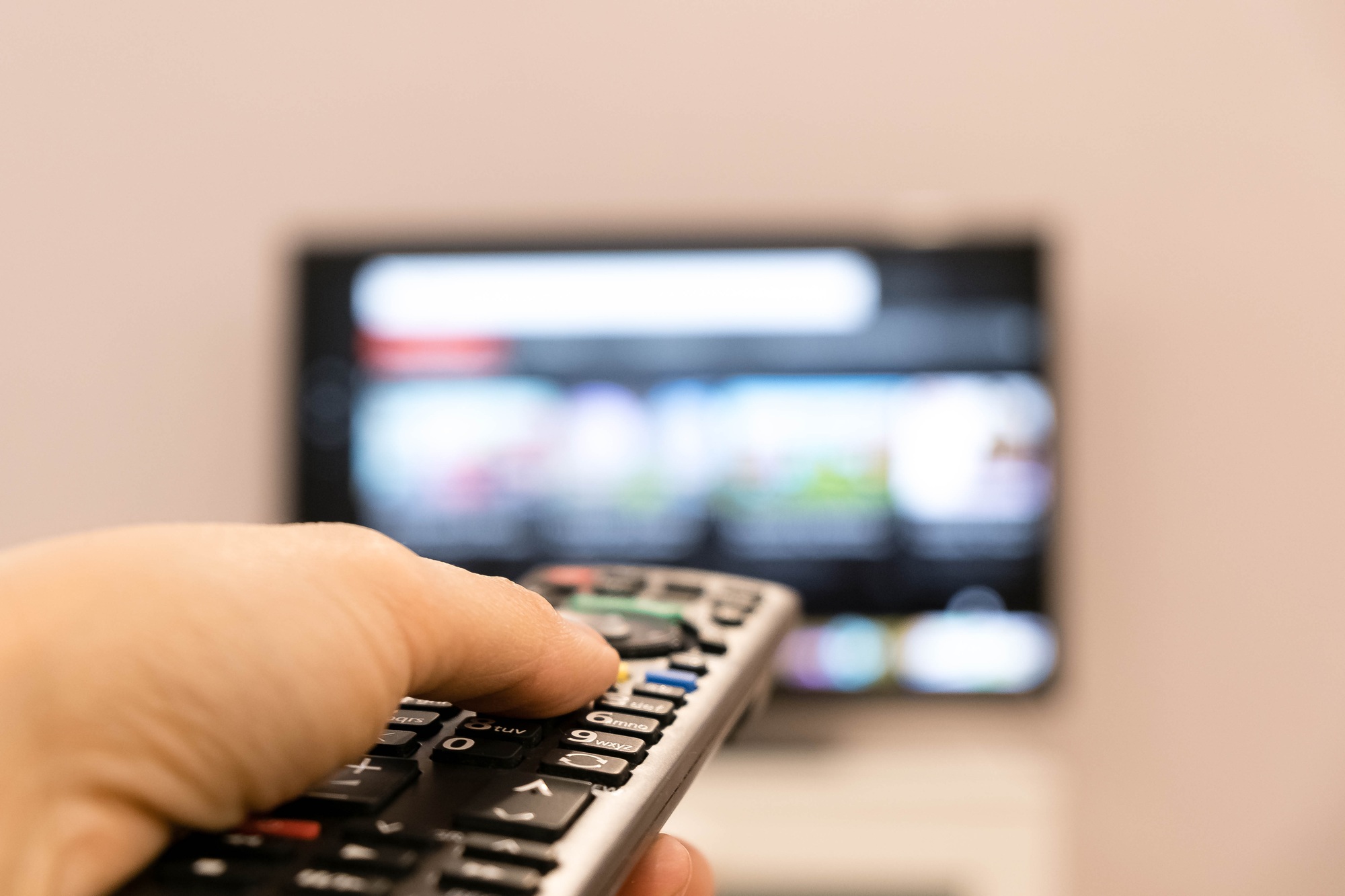 A remote being pointed at a TV